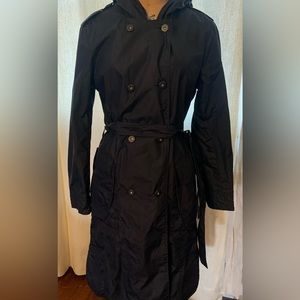 Designer full length black raincoat
Straight silhouette with high neck and hood